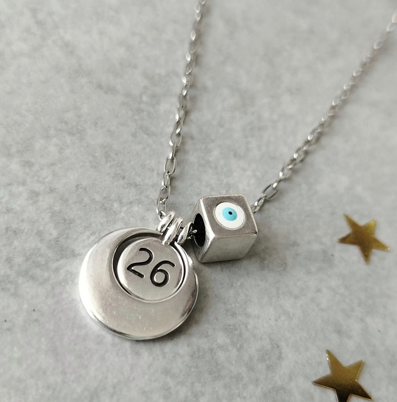 Κολιέ γούρι 2026 ασημί φλουρί και μάτι